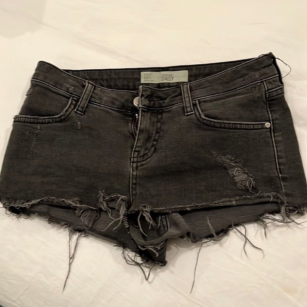 Frayed black jean shorts